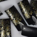 Designer tips gold flowers on black tips