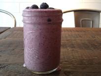 Glass of blueberry ginger smoothie