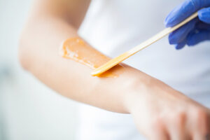 forearm being waxed