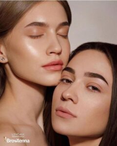 2 women wearing henna tint on their brows