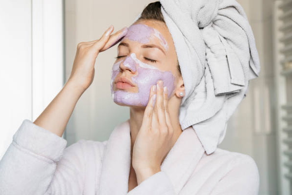women applying a face mask