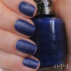 nails painted in navy liquid sand