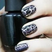 Nails painted in black and silver shatter fx