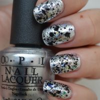 Nails painted with glitter over silver
