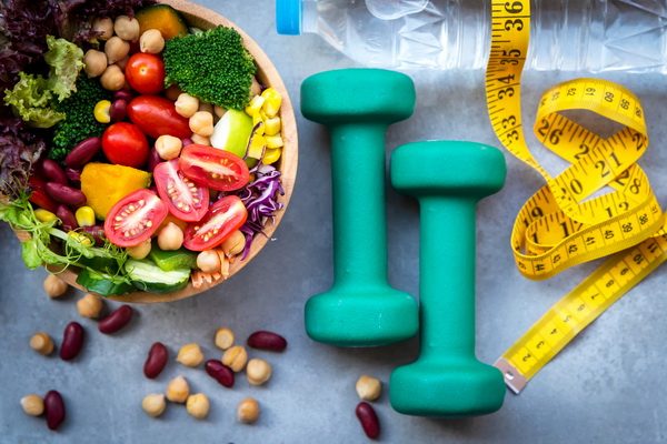 picture of salad, dumb bells, tape measure