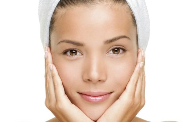 beautiful woman holding her face