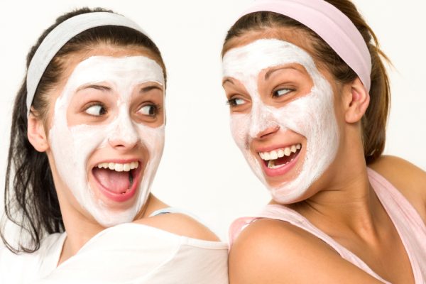 twins having a pamper day wearing face masks