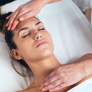 women receiving a reiki treatment